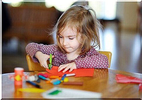 Teaching a child to cut with scissors