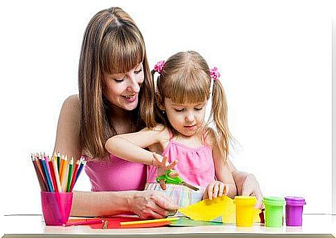 Teaching a child to cut with scissors